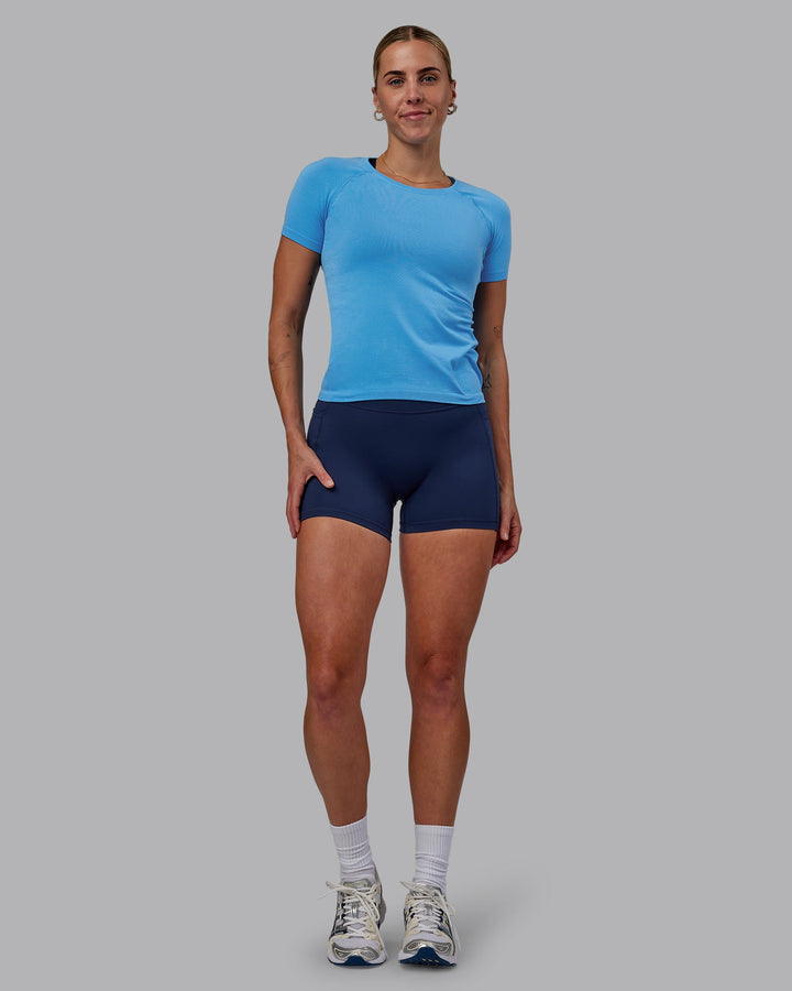 Woman wearing AeroFLX+ Seamless Tee - Azure Blue
