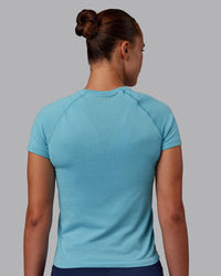 Woman wearing AeroFLX+ Seamless Tee - Retro Blue Marl | Model:Charlize | Size:S