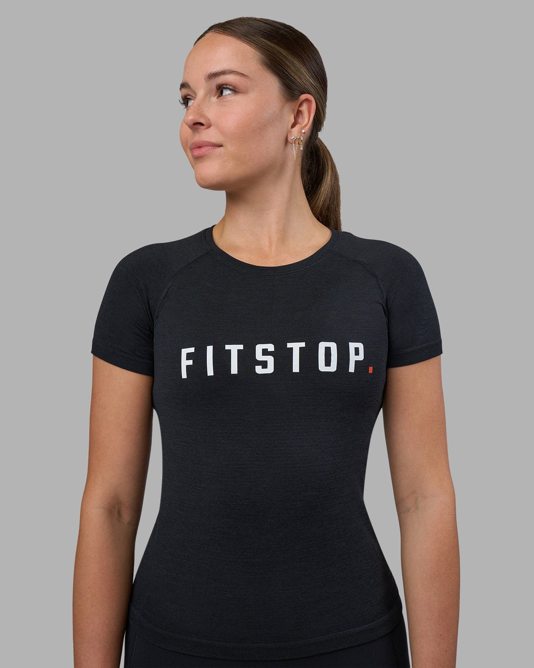 Woman wearing Fitstop AeroFLX+ Seamless Tee - Black | Model:Jade | Size:S