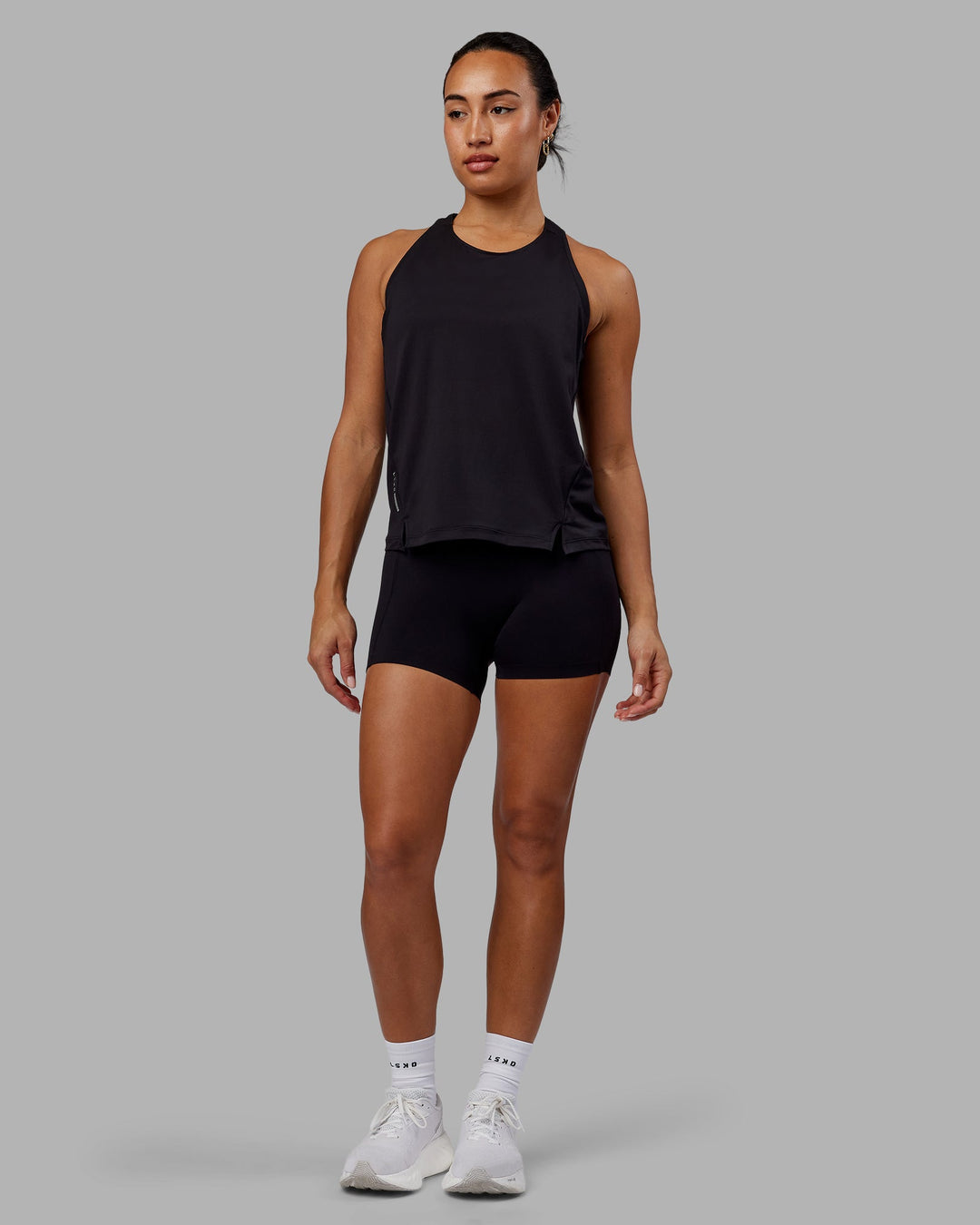 Woman wearing Pace Running Tank - Black