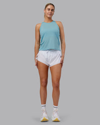 Woman wearing Pace Running Tank - Retro Blue | Model:Hannah | Size:S