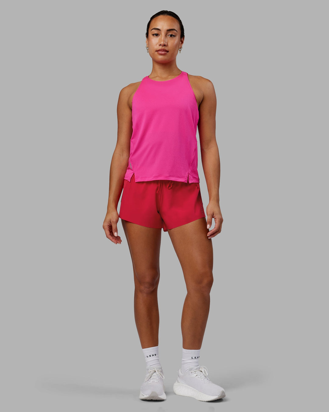 Woman wearing Pace Running Tank - Ultra Pink