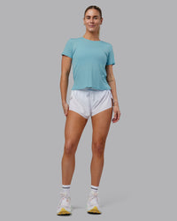 Woman wearing Pace Running Tee - Retro Blue | Model:Hannah | Size:S