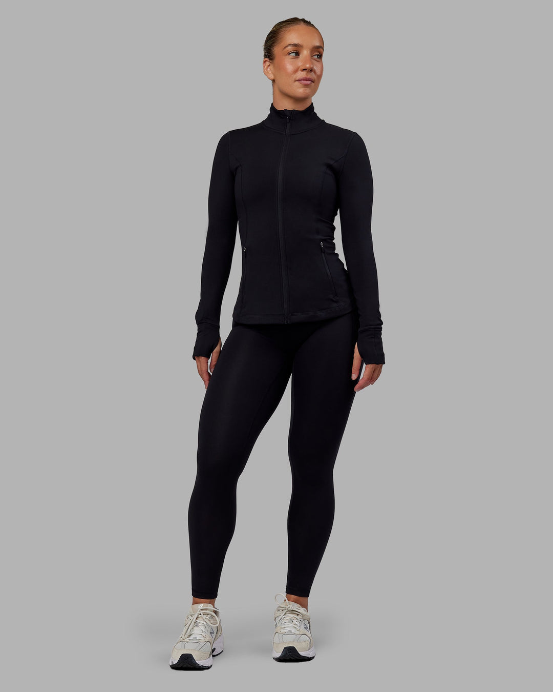 Woman wearing Stride Zip Through Jacket in Black | Size:S