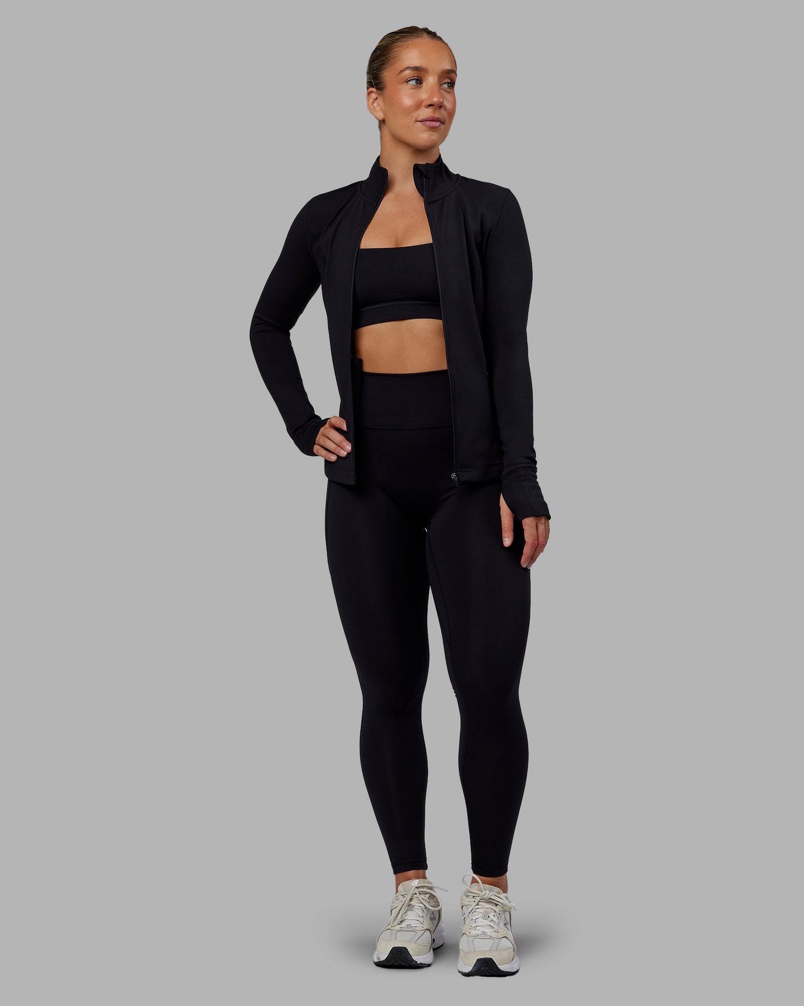 Woman wearing Stride Zip Through Jacket in Black | Size:S