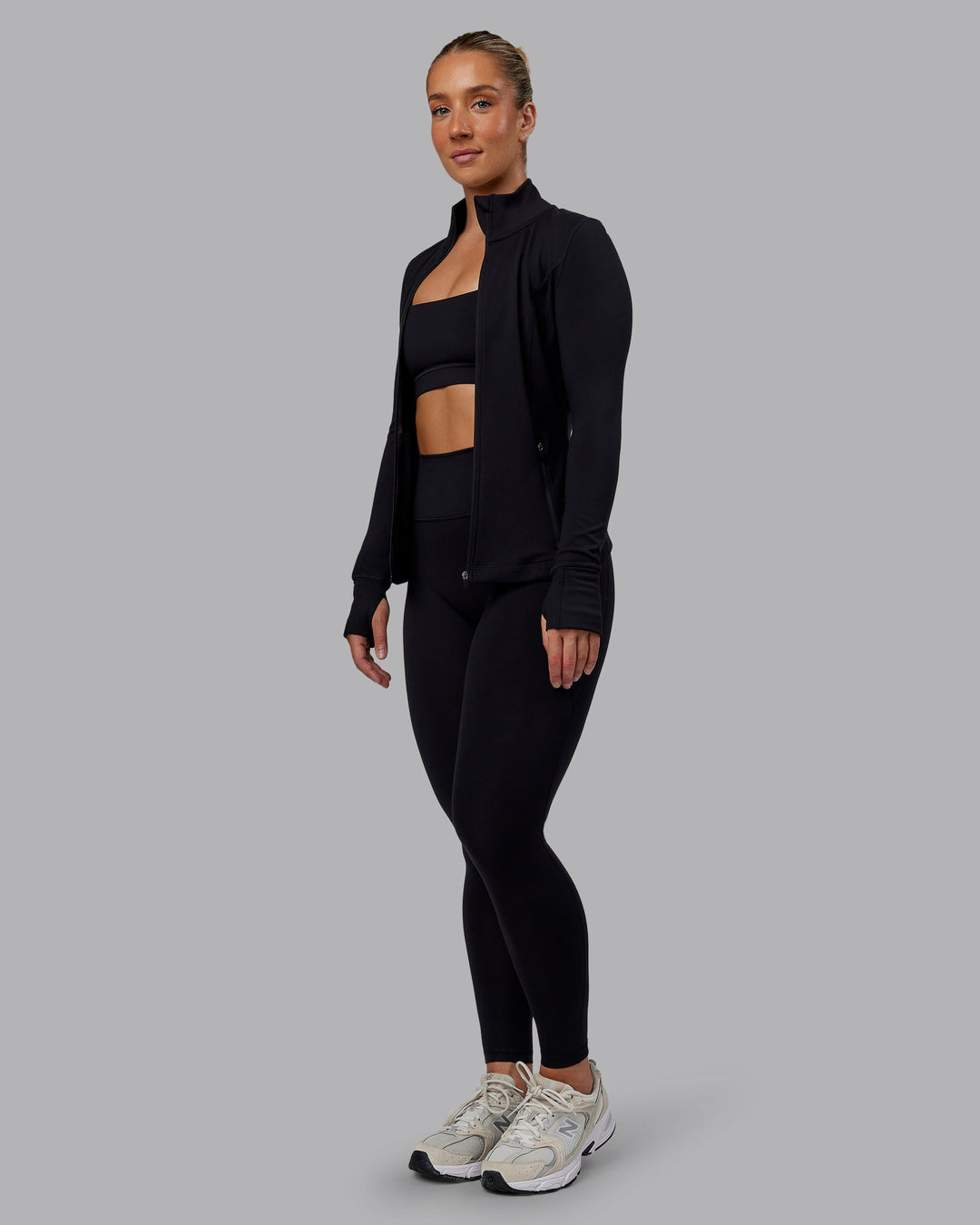 Woman wearing Stride Zip Through Jacket in Black | Size:S