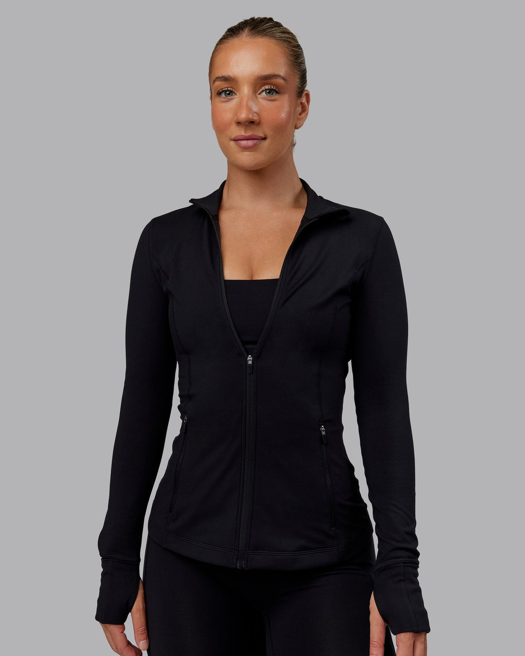 Woman wearing Stride Zip Through Jacket in Black | Size:S