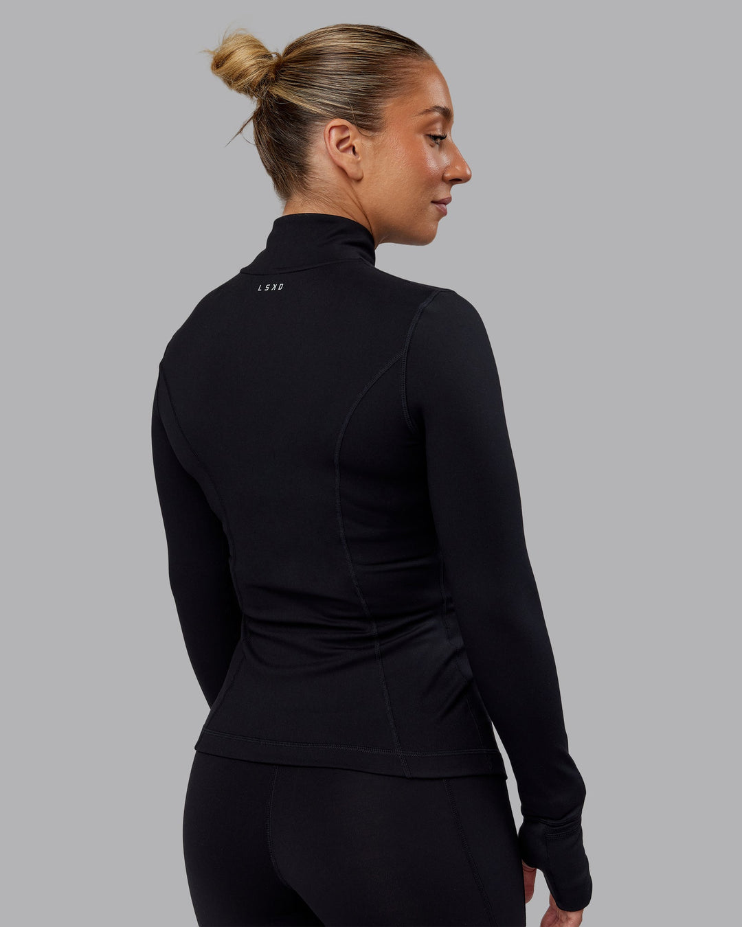 Woman wearing Stride Zip Through Jacket in Black | Size:S