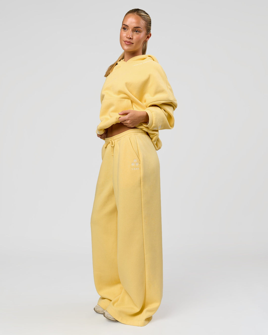 Woman wearing Zola Oversized Hoodie - Lemon | Model:Issy | Size:S