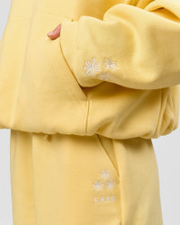 Woman wearing Zola Oversized Hoodie - Lemon | Model:Issy | Size:S