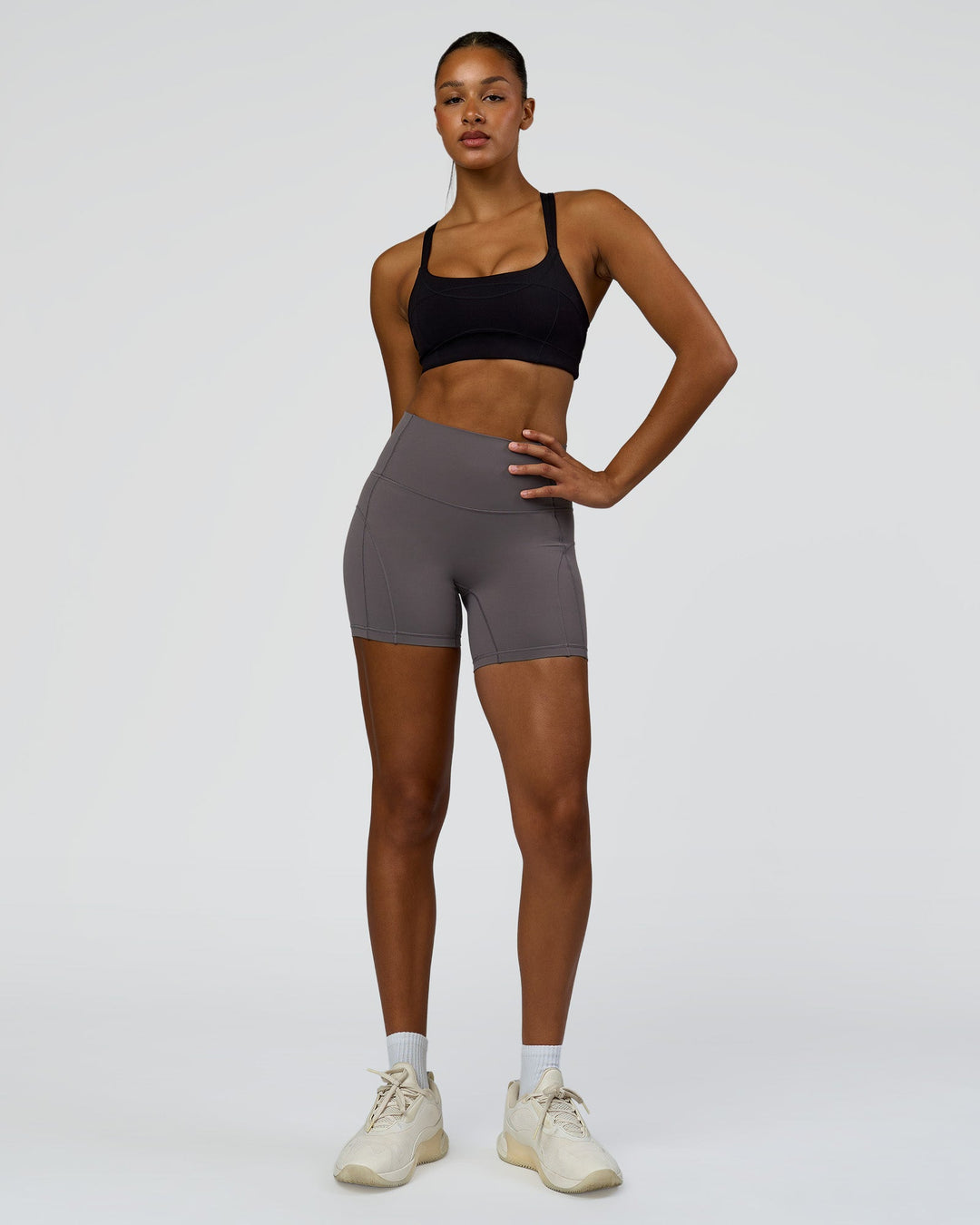 Woman wearing Inertia Sports Bra - Black | Model:Rosie | Size:S