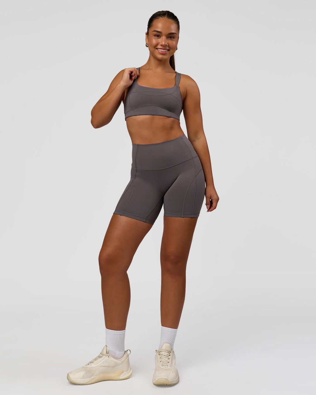 Woman wearing Inertia Sports Bra - Duskstone | Model:Rosie | Size:S