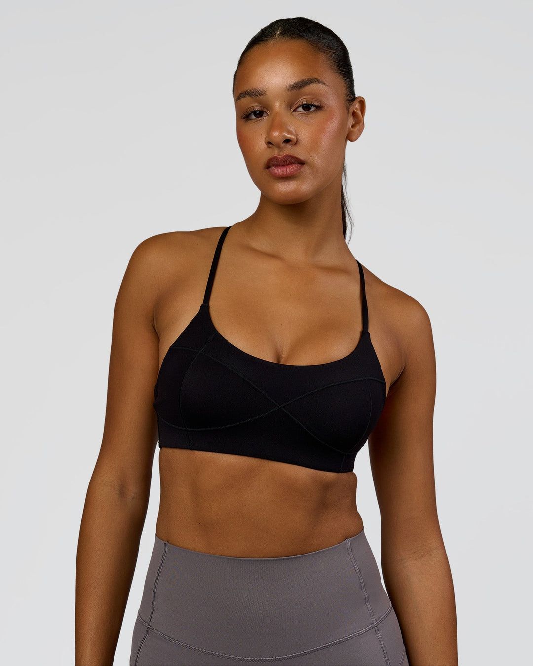 Woman wearing Infinite Contour Sports Bra - Black | Model:Rosie | Size:S