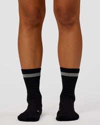 Woman wearing Run Club Fast Performance Socks 2.0 - Black-Reflective | Thumbnail Index: 6