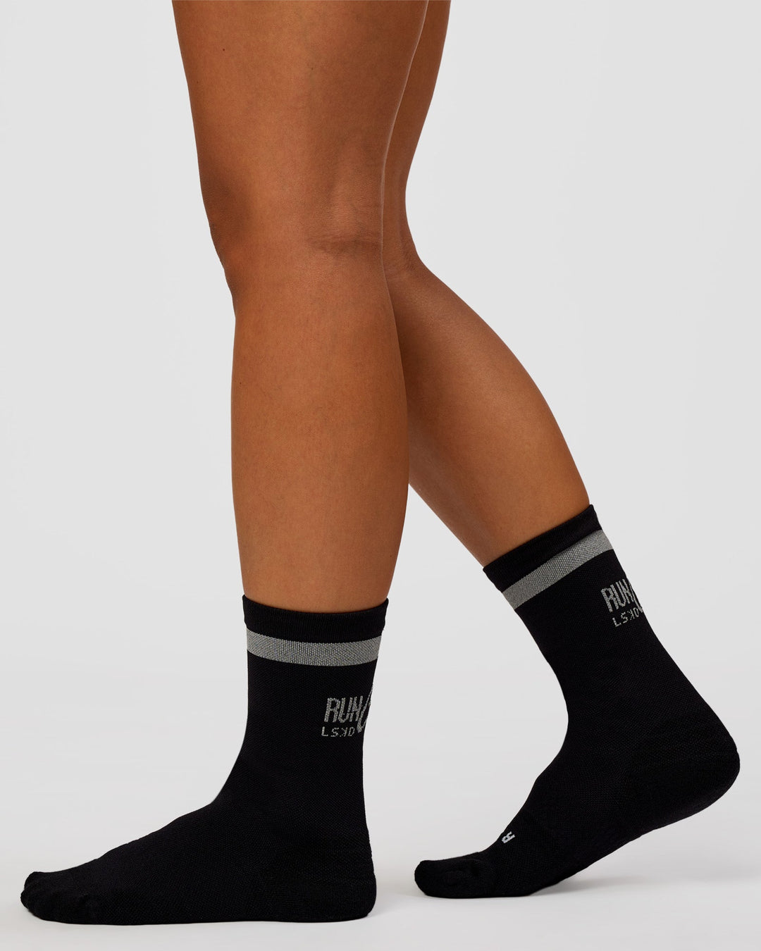 Woman wearing Run Club Fast Performance Socks 2.0 - Black-Reflective - view 4