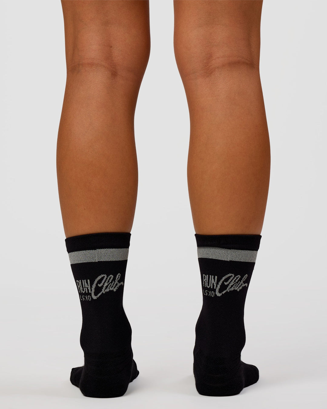 Woman wearing Run Club Fast Performance Socks 2.0 - Black-Reflective - view 8