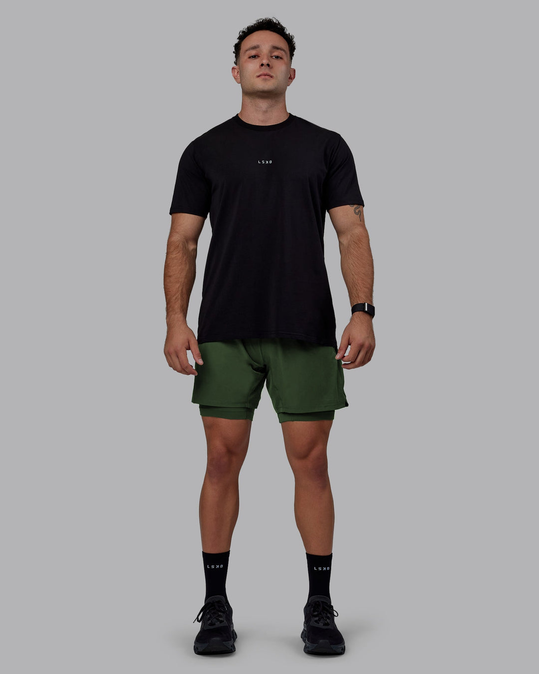 Man wearing Challenger 6&quot; Lined Performance Shorts - Cilantro