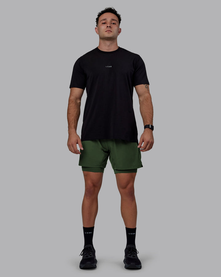 Man wearing Challenger 6&quot; Lined Performance Shorts - Cilantro
