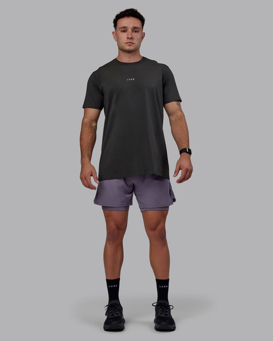 Man wearing Challenger 6&quot; Lined Performance Shorts - Purple Sage