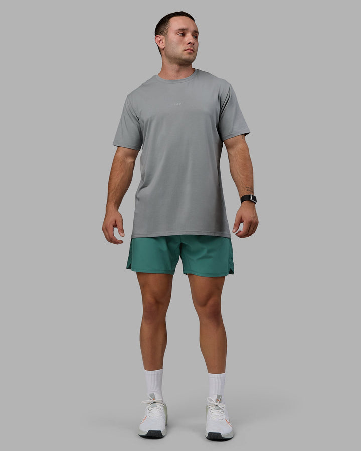 Man wearing Challenger 6&quot; Lined Performance Shorts - Sagebrush
