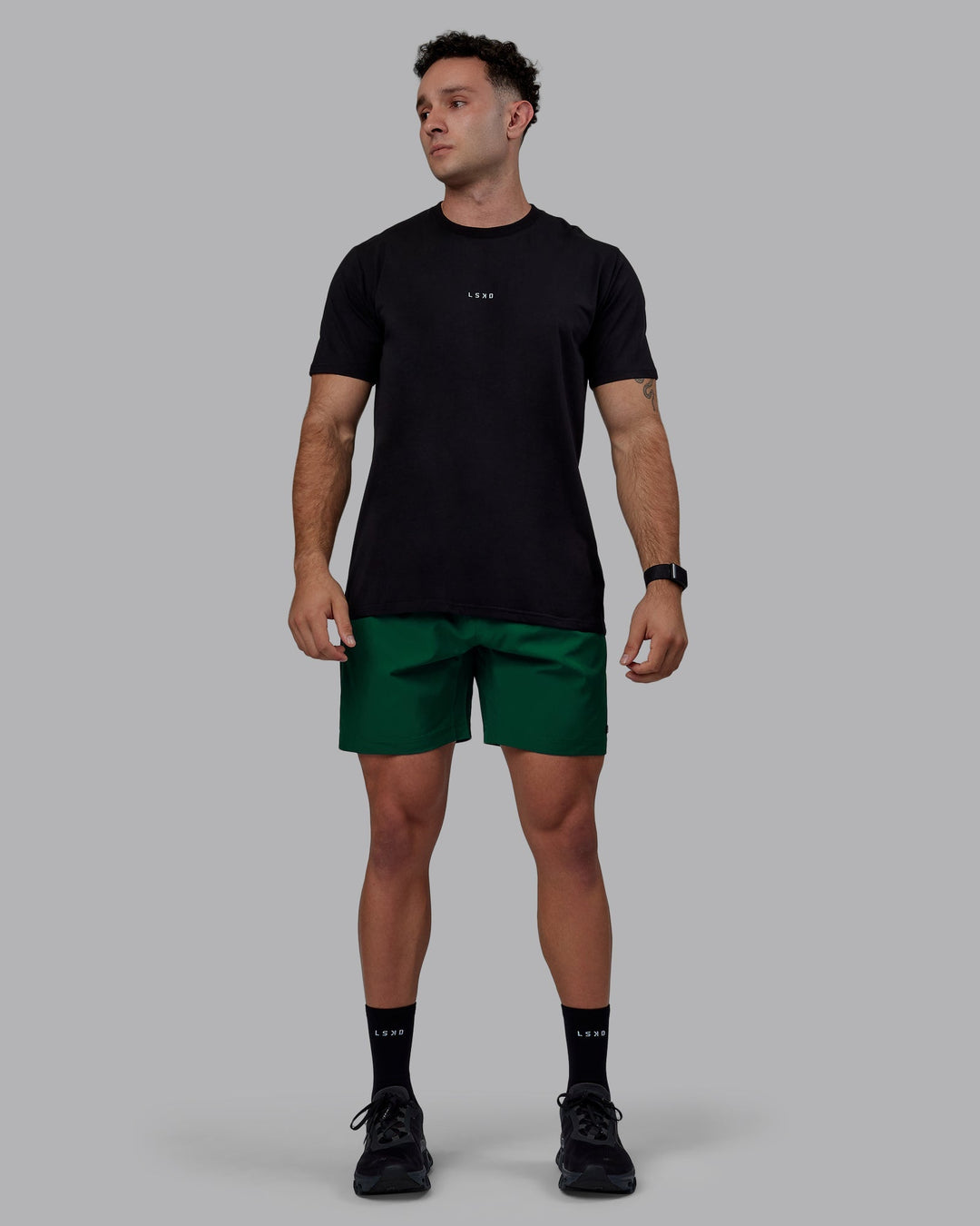 Man wearing Rep 7&quot; Performance Shorts - Deep Emerald