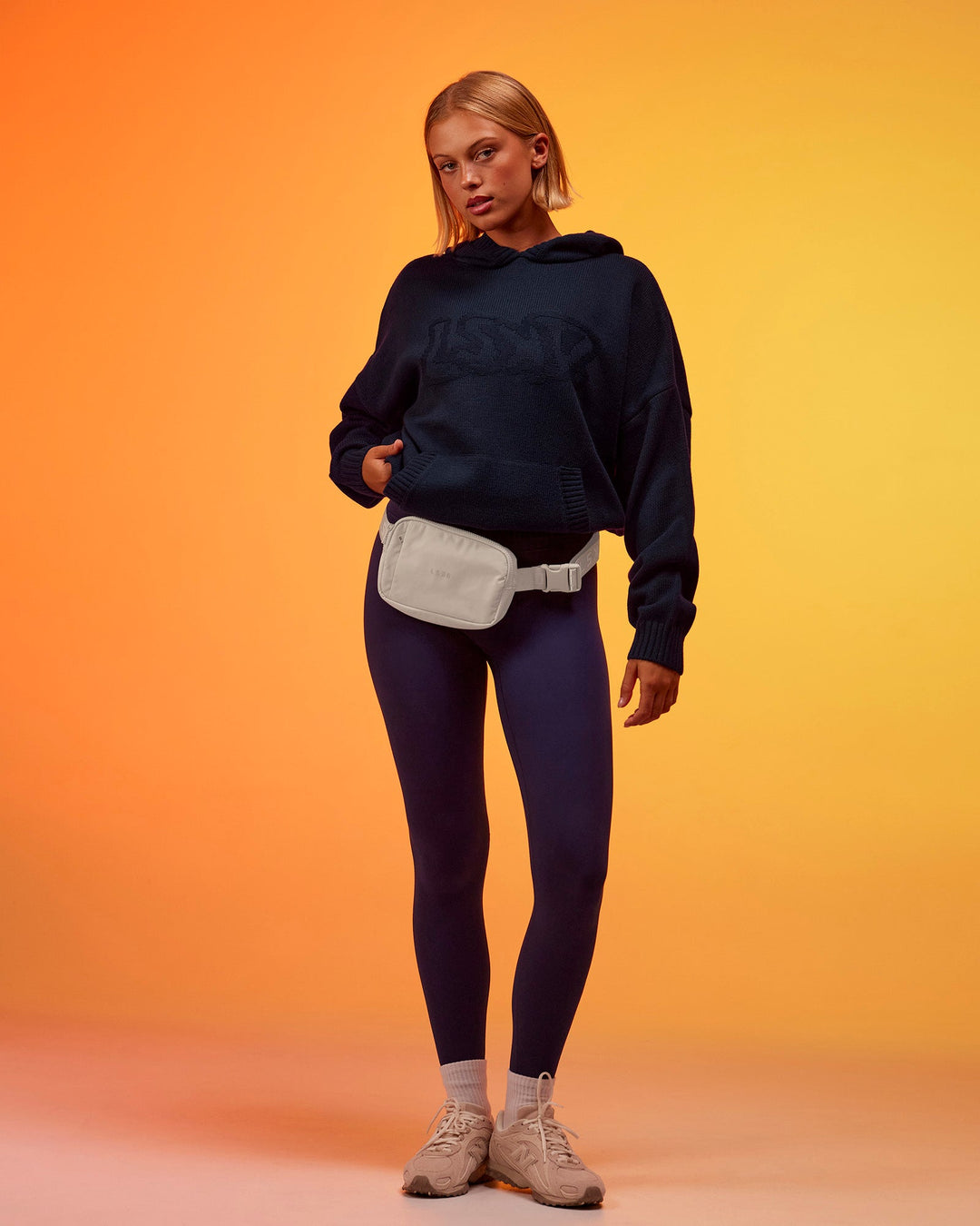 Woman wearing All Day Active Knitted Hoodie - Future Navy | Model:Hailey | Size:XS