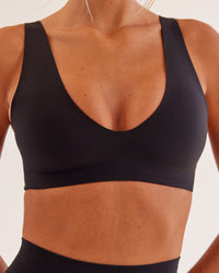Woman wearing Bend & FLX Plunge Sports Bra - Black | Model:Georgia | Size:XS