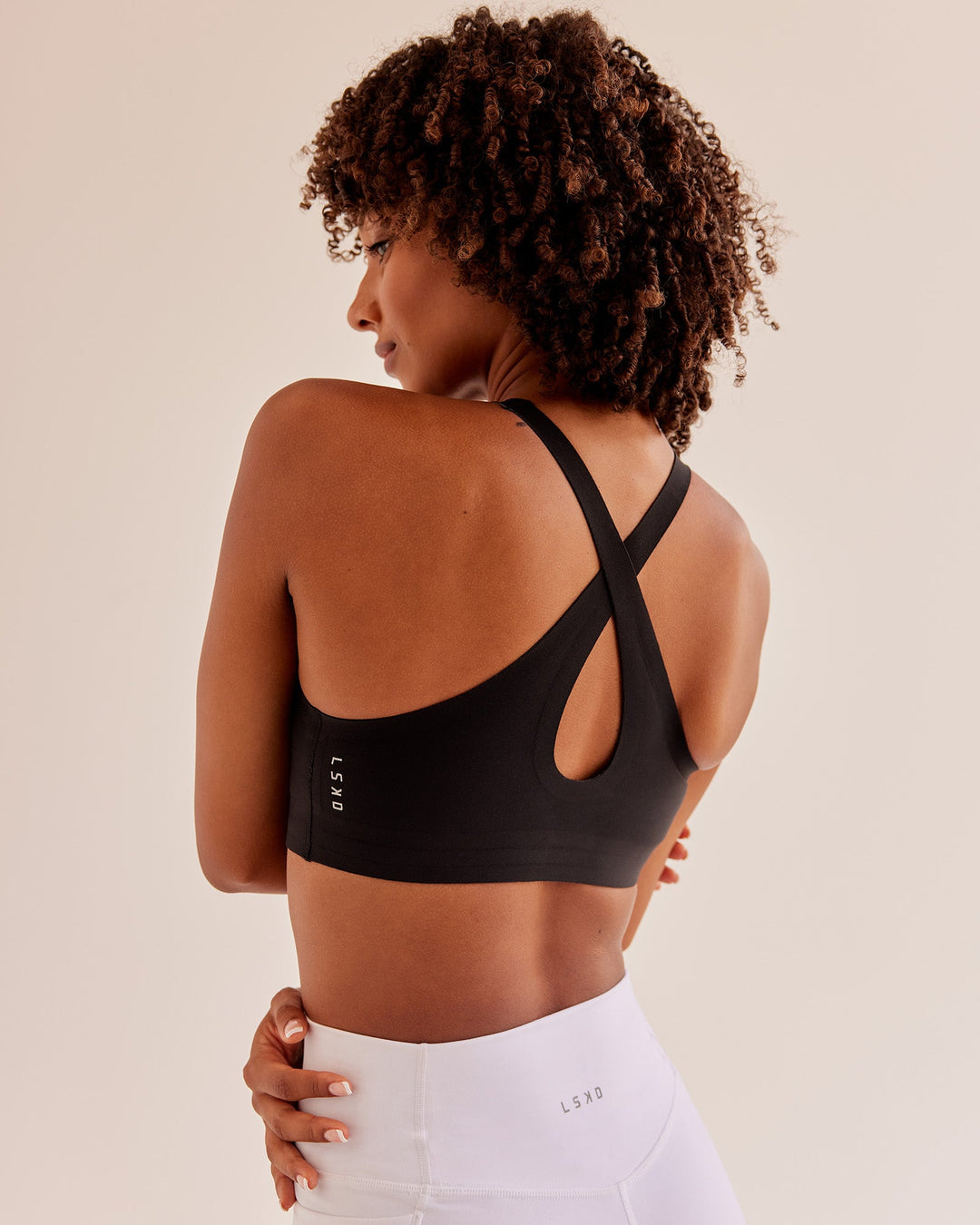 Woman wearing Bend &amp; FLX Plunge Sports Bra - Black | Model:Tomi | Size:XS