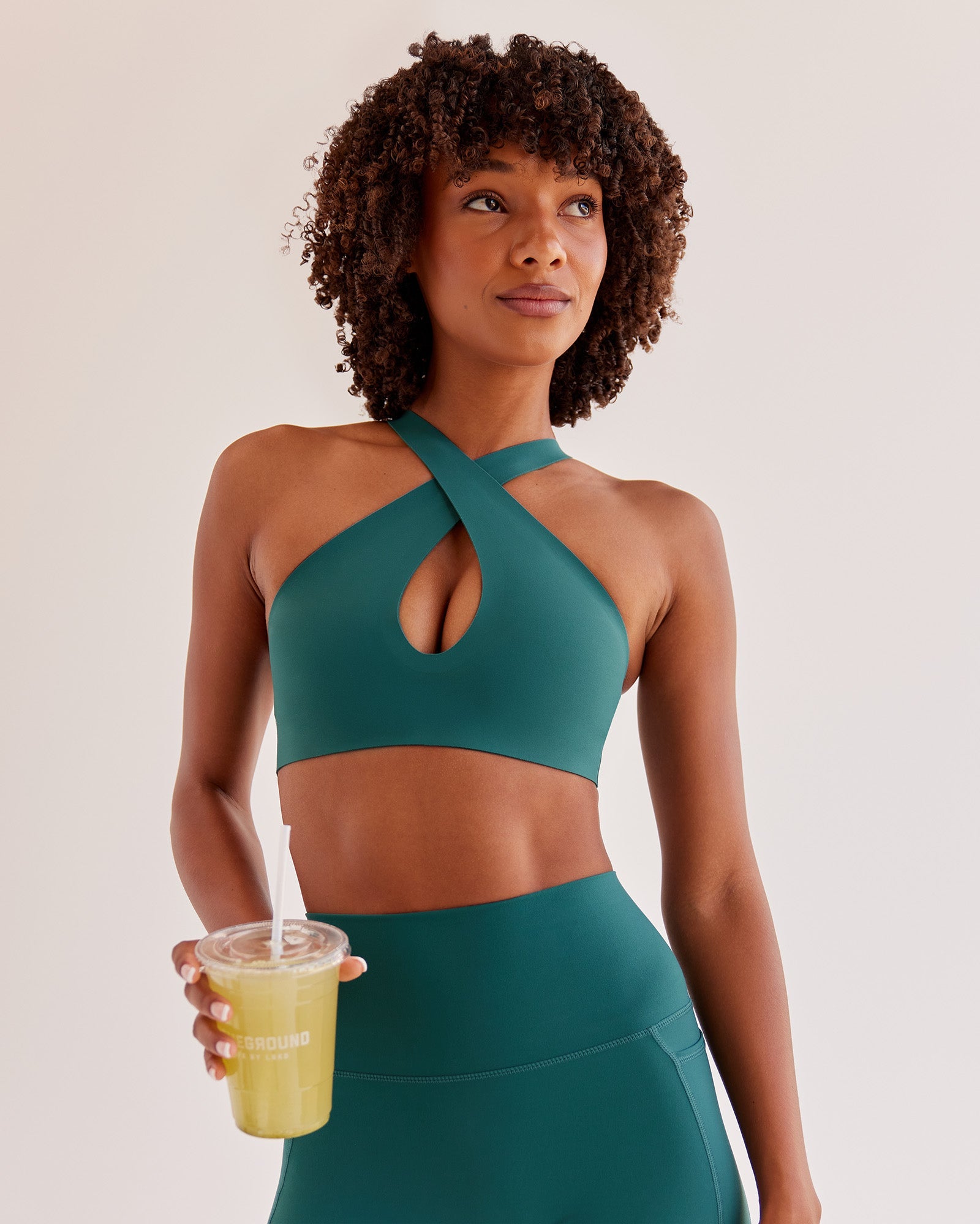 Woman wearing Bend & FLX Plunge Sports Bra - Transformative Teal | Model:Tomi | Size:XS