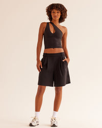 Woman wearing Bend & FLX Plunge Tank - Black | Model:Tomi | Size:XS