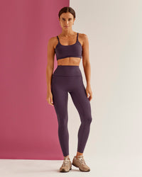 Woman wearing Elixir Ultra High-Rise Full Length Legging Pockets - Midnight Plum | Model:Bruna | Size:XS