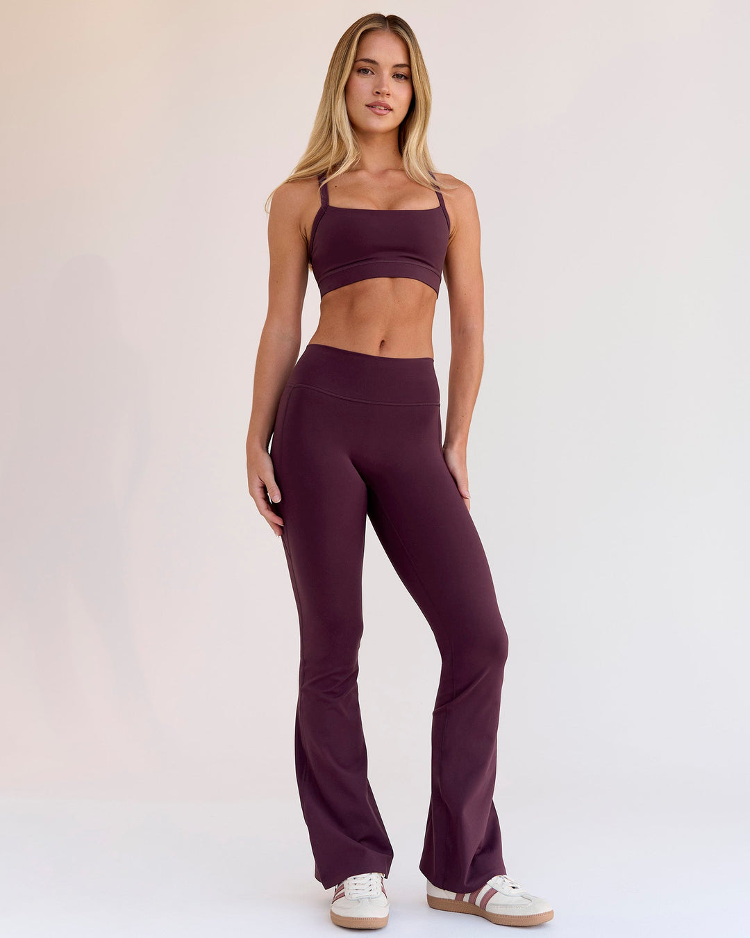 Woman wearing Fusion V-Contour High-Rise Flared Petite Legging Pockets - Cherry Lacquer | Model:Issy | Size:XS - view 5