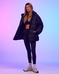 Woman wearing Go-To Puffer Mid Jacket - Black | Model:Georgia | Size:XS