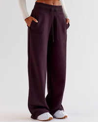 Woman wearing Go-To Wide Leg Track Pant - Midnight Plum | Model:Jaimee | Size:XS