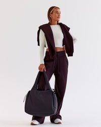 Woman wearing Go-To Wide Leg Track Pant - Midnight Plum | Model:Jaimee | Size:XS