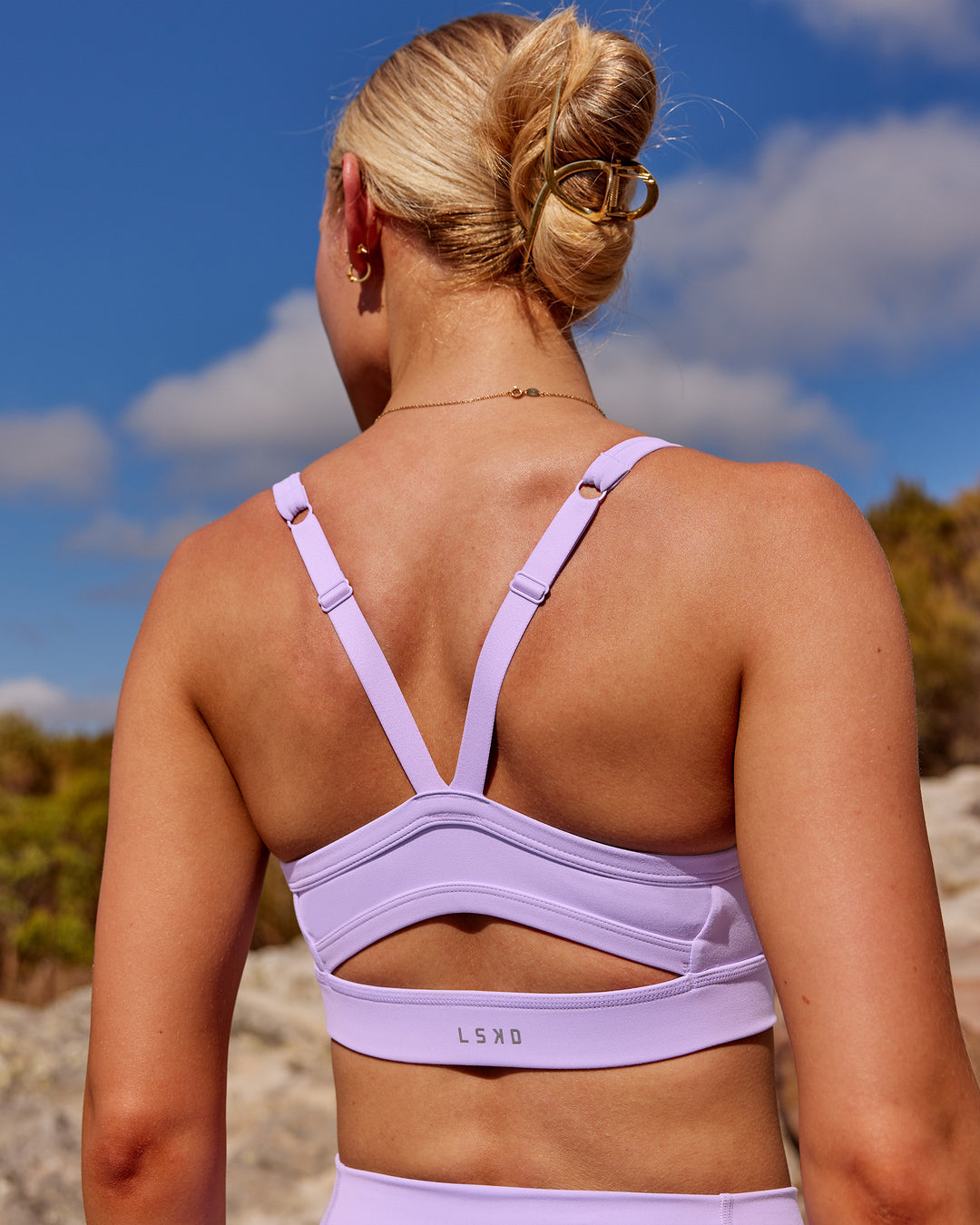 Woman wearing Momentum Sports Bra - Pale Lilac | Model:Kait | Size:XS
