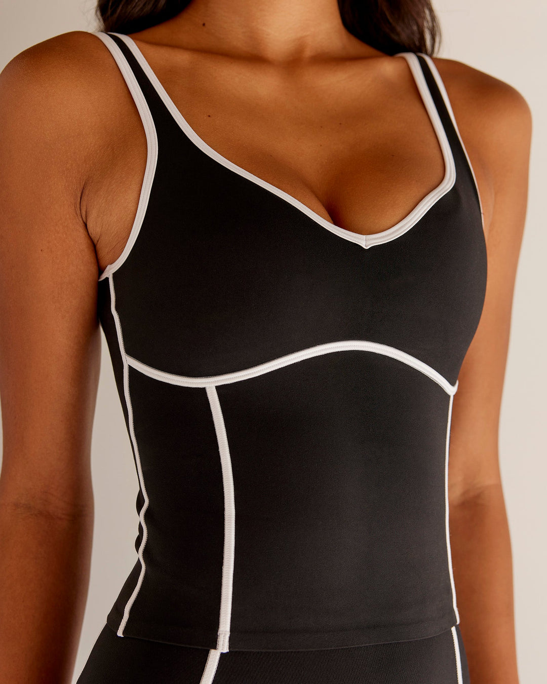 Woman wearing Power Sweetheart Shelf Bra Tank - Black | Model:Tali | Size:XS