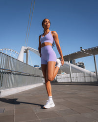 Woman wearing Sculpt Sports Bra - Violet Ray | Model:Txai | Size:XS