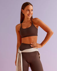 Woman wearing Twist Sports Bra - Hot Chocolate | Model:Brylee | Size:XS