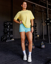 Woman wearing Unfit Club FLXCotton Oversized Tee - Yellow Fizz Washed-Ultra Fuchsia | Model:Abbey | Size:XS | Thumbnail Index: 2
