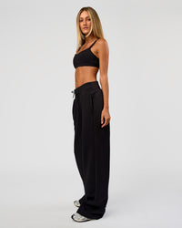 Woman wearing Go-To Wide Leg Track Pant Tall - Black | Model:Georgia | Size:XS