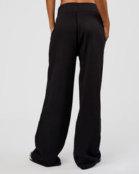 Woman wearing Go-To Wide Leg Track Pant Tall - Black | Model:Georgia | Size:XS
