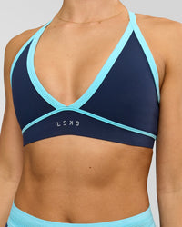 Woman wearing Breeze Sports Bra - Future Navy-Baltic Sea | Model:Grace | Size:XS
