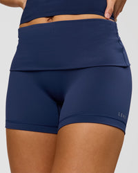 Woman wearing Groovy High Rise Fold Over 4" Short - Future Navy | Model:Grace | Size:XS