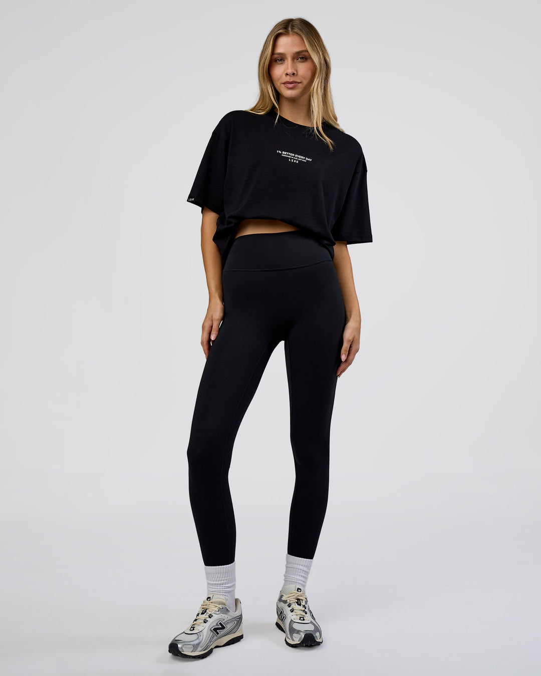 Woman wearing 1% Better Every Day EST FLXCotton Oversized Tee - Black | Model:Leilani | Size:XS