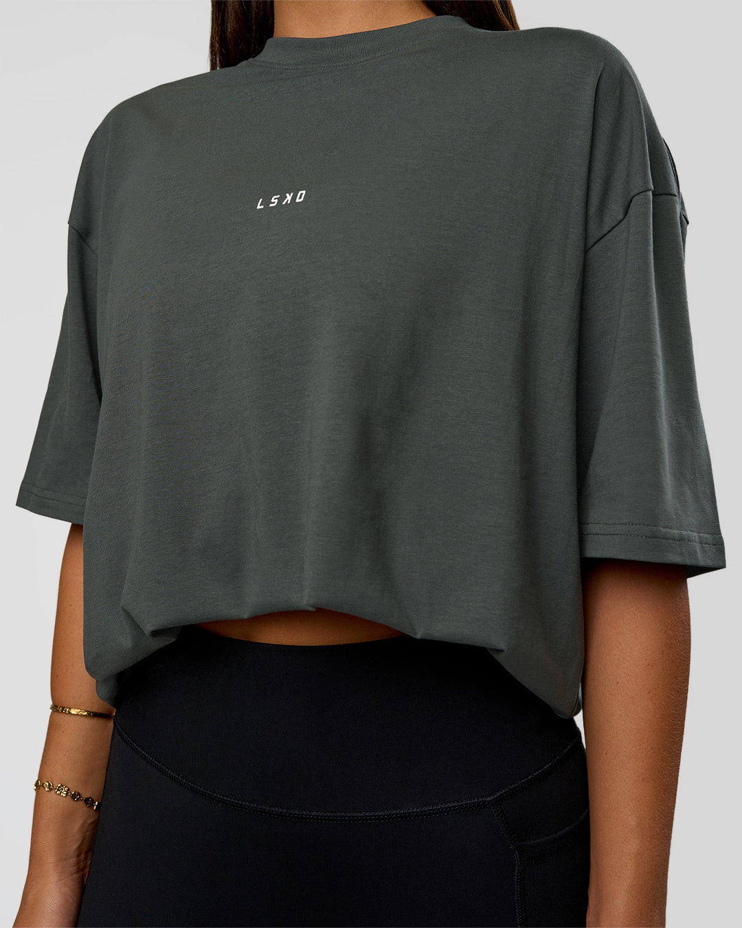 Woman wearing Abstract Haze FLXCotton Tee - Carbon Green-Cantaloupe | Model:Bianca | Size:XS