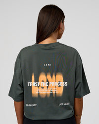 Woman wearing Abstract Haze FLXCotton Tee - Carbon Green-Cantaloupe | Model:Bianca | Size:XS