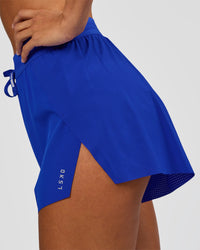 Woman wearing Accelerate 3" High-Rise Running Short - Electric Indigo | Set:true | Angle:closeup | Model:Brylee | Size:XS