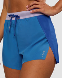 Woman wearing Accelerate 3" High-Rise Running Short - Electric Indigo-Multi | Set:true | Angle:closeup | Model:Brylee | Size:XS