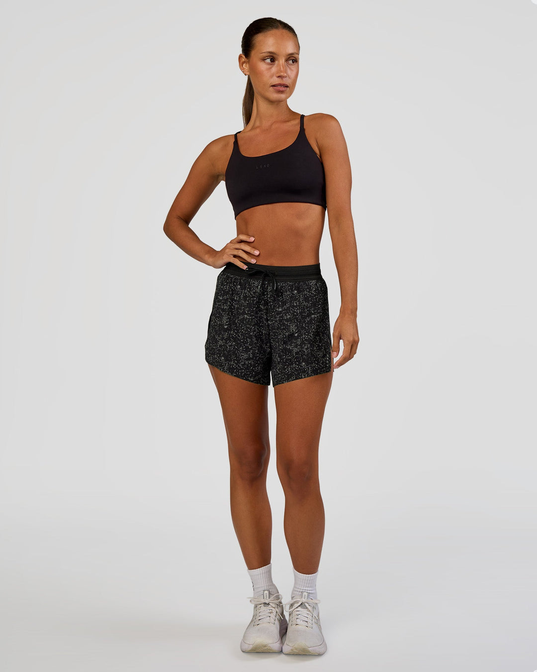 Woman wearing Accelerate 3" High-Rise Running Short - Energy Print Black | Model:Brylee | Size:XS